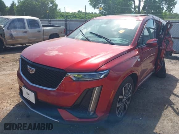 ✅ 2021 Cadillac XT6 Sport • VIN: 1GYKPGRS9MZ136205 • Lot: 39385075. Listed on IAAI with 48,886 mi. Free auction sales archive from the USA and detailed vehicle history report at DreamBid. Image 2.