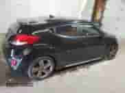 2015 Hyundai Veloster Turbo z VIN KMHTC6AE5FU226436, wystawiony jako Copart lot #49742034 z przebiegiem 99 852 mil mil oraz . Historia ofert i sprzedaży dostępna na DreamBid. Obrazek 3.
