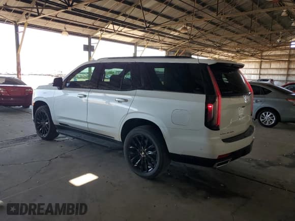 ✅ 2022 Cadillac Escalade Premium Luxury • VIN: 1GYS3BKL0NR296993 • Лот: 63444015. Опубликован ранее на Copart с пробегом 59 128 миль. Бесплатный доступ к архиву аукционных продаж из США и подробный отчёт об истории автомобиля на DreamBid. Изображение 2.