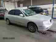 2001 Hyundai Elantra GLS z VIN KMHDN45D61U069948, wystawiony jako Copart lot #69787253 z przebiegiem 251 000 mil mil oraz Szkoda całkowita • Salvage title. Historia ofert i sprzedaży dostępna na DreamBid. Obrazek 4.