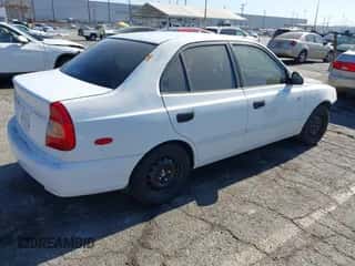 2002 Hyundai Accent GL z VIN KMHCG45C42U375352, wystawiony jako IAAI lot #42699297 z przebiegiem 103 540 mil mil oraz . Historia ofert i sprzedaży dostępna na DreamBid. Obrazek 4.