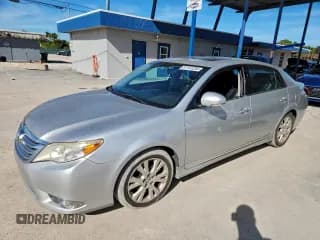 ✅ 2012 Toyota Avalon • VIN: 4T1BK3DB9CU454479 • Lot: 97107235. Listed on Copart with 105,255 mi. Free auction sales archive from the USA and detailed vehicle history report at DreamBid. Image 1.