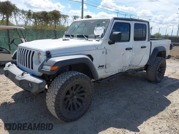 ✅ 2020 Jeep Gladiator Sport S • VIN: 1C6HJTAG3LL125405 • Lot: 43379807. Wystawiony na IAAI z przebiegiem 102 440 mil. Bezpłatny archiwum sprzedaży aukcyjnych z USA i szczegółowy raport historii pojazdu na DreamBid. Zdjęcie 2.