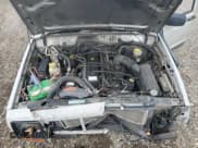 ✅ 2001 Jeep Cherokee • VIN: 1J4FT28S71L507698 • Lot: 57991985. Listed on Copart with Not provided. Free auction sales archive from the USA and detailed vehicle history report at DreamBid. Image 12.