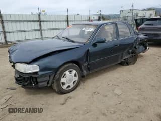 ✅ 1994 Toyota Camry LE • VIN: JT2GK12E2R0039606 • Лот: 49840015. Опубликован ранее на Copart с пробегом 197 834 миль. Бесплатный доступ к архиву аукционных продаж из США и подробный отчёт об истории автомобиля на DreamBid. Изображение 1.