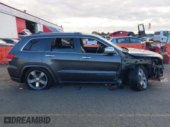 ✅ 2015 Jeep Grand Cherokee Overland • VIN: 1C4RJFCG3FC697994 • Lot: 40526924. Listed on IAAI with 199,275 mi. Free auction sales archive from the USA and detailed vehicle history report at DreamBid. Image 13.
