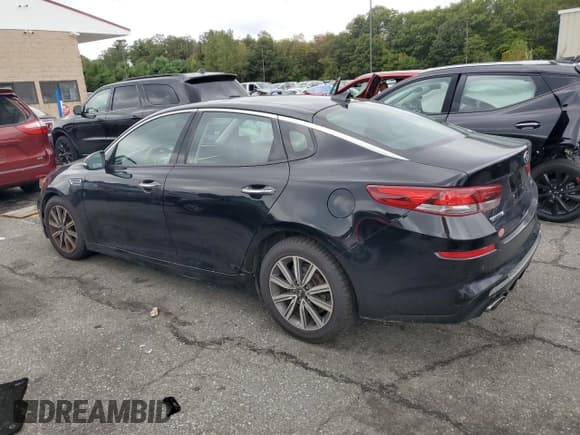 ✅ 2019 Kia Optima EX • VIN: 5XXGU4L11KG315938 • Лот: 81035045. Опубликован ранее на Copart с пробегом 86 522 миль. Бесплатный доступ к архиву аукционных продаж из США и подробный отчёт об истории автомобиля на DreamBid. Изображение 2.