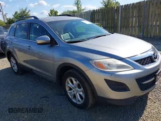 ✅ 2012 Mazda CX-9 Touring • VIN: JM3TB3CV7C0357042 • Lot: 43158515. Wystawiony na IAAI z przebiegiem 93 778 mil. Bezpłatny archiwum sprzedaży aukcyjnych z USA i szczegółowy raport historii pojazdu na DreamBid. Zdjęcie 1.