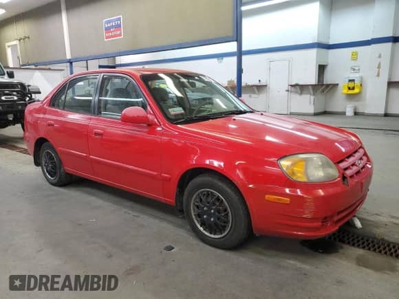 2005 Hyundai Accent GLS with VIN KMHCG45C05U661607, listed as a Copart auction lot 71812814 with 238,630 mi miles and Salvage title. Bid and sale history available at DreamBid. Image 4.
