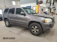 ✅ 2003 Mazda Tribute LX • VIN: 4F2YZ04173KM05549 • Lot: 86702895. Listed on Copart with 128,757 mi. Free auction sales archive from the USA and detailed vehicle history report at DreamBid. Image 4.