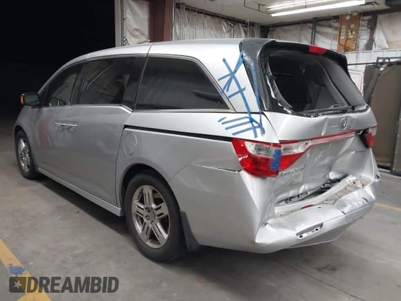 ✅ 2012 Honda Odyssey Touring • VIN: 5FNRL5H90CB004537 • Lot: 43184321. Listed on IAAI with 132,469 mi. Free auction sales archive from the USA and detailed vehicle history report at DreamBid. Image 3.