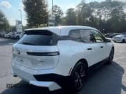 ✅ 2025 BMW iX xDrive50 • VIN: WB523CF00SCS98944 • Lot: 79060344. Listed on Copart with 8 mi. Free auction sales archive from the USA and detailed vehicle history report at DreamBid. Image 4.