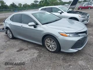 ✅ 2020 Toyota Camry Hybrid XLE • VIN: 4T1F31AK0LU519386 • Lot: 43175906. Listed on IAAI with 33,991 mi. Free auction sales archive from the USA and detailed vehicle history report at DreamBid. Image 1.