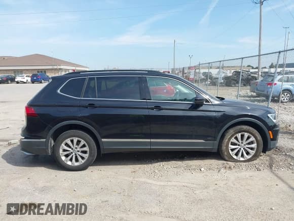 ✅ 2018 Volkswagen Tiguan SEL • VIN: 3VV2B7AX0JM084778 • Лот: 43200447. Опубликован ранее на IAAI с пробегом 77 889 миль. Бесплатный доступ к архиву аукционных продаж из США и подробный отчёт об истории автомобиля на DreamBid. Изображение 13.