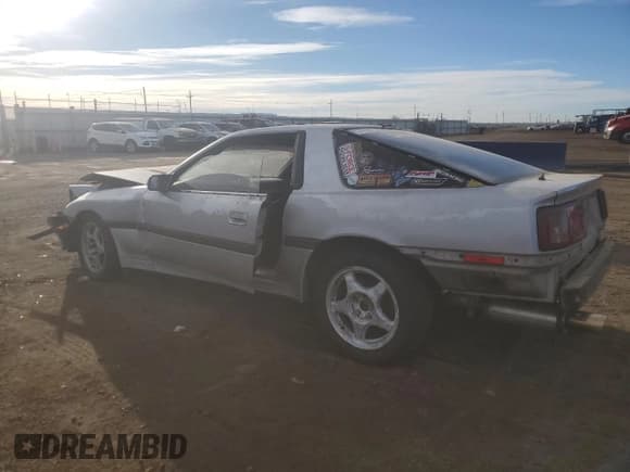 ✅ 1986 Toyota Supra • VIN: JT2MA70L9G0022115 • Лот: 43794455. Опубликован ранее на Copart с пробегом 115 995 миль. Бесплатный доступ к архиву аукционных продаж из США и подробный отчёт об истории автомобиля на DreamBid. Изображение 2.