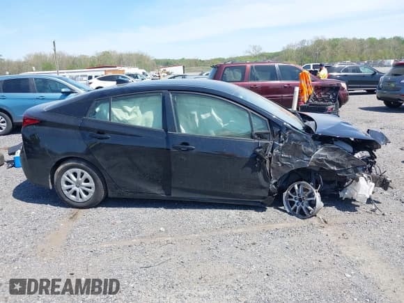 ✅ 2021 Toyota Prius L Eco • VIN: JTDKAMFU6M3150237 • Lot: 42085038. Listed on IAAI with 86,175 mi. Free auction sales archive from the USA and detailed vehicle history report at DreamBid. Image 14.