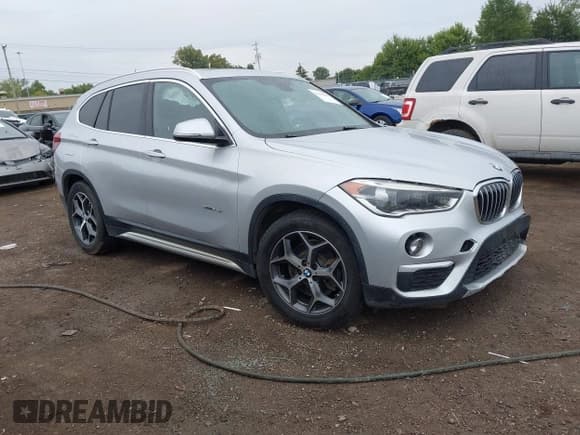 ✅ 2017 BMW X1 xDrive28i • VIN: WBXHT3Z30H4A53557 • Lot: 43104541. Listed on IAAI with 103,544 mi. Free auction sales archive from the USA and detailed vehicle history report at DreamBid. Image 1.