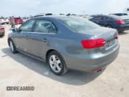 ✅ 2013 Volkswagen Jetta TDI w/Premium/Nav • VIN: 3VWLL7AJXDM291045 • Lot: 43227963. Listed on IAAI with 151,843 mi. Free auction sales archive from the USA and detailed vehicle history report at DreamBid. Image 3.