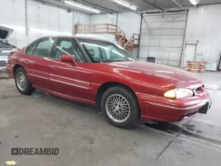 ✅ 1997 Pontiac Bonneville SE • VIN: 1G2HX52K5VH261373 • Lot: 40736098. Wystawiony na IAAI z przebiegiem 144 314 mil. Bezpłatny archiwum sprzedaży aukcyjnych z USA i szczegółowy raport historii pojazdu na DreamBid. Zdjęcie 1.