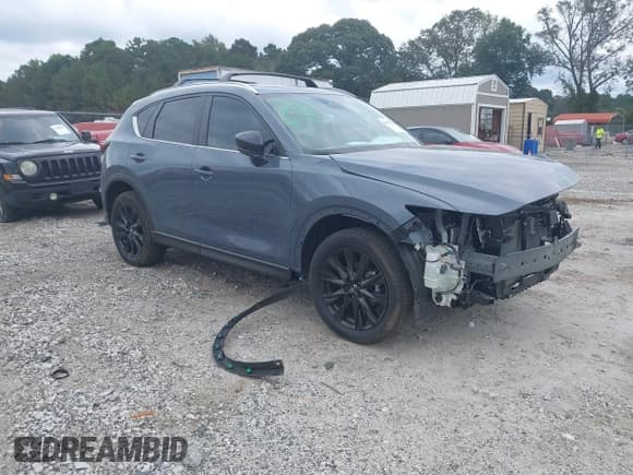 ✅ 2025 Mazda CX-5 S Carbon Edition • VIN: JM3KFBCM4S0600371 • Lot: 43293266. Listed on IAAI with 5,102 mi. Free auction sales archive from the USA and detailed vehicle history report at DreamBid. Image 1.
