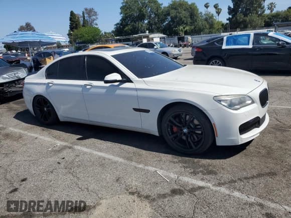 ✅ 2013 BMW 7 Series 750i • VIN: WBAYA8C54DC996412 • Lot: 56982895. Listed on Copart with 124,258 mi. Free auction sales archive from the USA and detailed vehicle history report at DreamBid. Image 4.