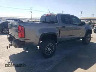 ✅ 2022 Chevrolet Colorado 4WD ZR2 • VIN: 1GCGTEEN4N1310791 • Лот: 70468184. Опубликован ранее на Copart с пробегом 27 006 миль. Бесплатный доступ к архиву аукционных продаж из США и подробный отчёт об истории автомобиля на DreamBid. Изображение 3.