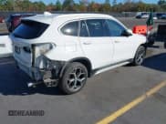 ✅ 2018 BMW X1 xDrive28i • VIN: WBXHT3C38J3H30018 • Lot: 43694942. Listed on IAAI with 50,899 mi. Free auction sales archive from the USA and detailed vehicle history report at DreamBid. Image 4.