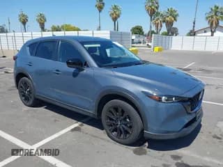 ✅ 2022 Mazda CX-5 S Carbon Edition • VIN: JM3KFBCM7N1601447 • Lot: 42463014. Listed on IAAI with 37,126 mi. Free auction sales archive from the USA and detailed vehicle history report at DreamBid. Image 1.