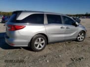 ✅ 2019 Honda Odyssey EX-L • VIN: 5FNRL6H71KB097104 • Лот: 90592755. Опубликован ранее на Copart с пробегом 105 788 миль. Бесплатный доступ к архиву аукционных продаж из США и подробный отчёт об истории автомобиля на DreamBid. Изображение 3.