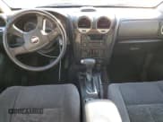 ✅ 2006 GMC Envoy SLE • VIN: 1GKES16SX66173565 • Лот: 43982355. Опубликован ранее на Copart с пробегом 297 894 миль. Бесплатный доступ к архиву аукционных продаж из США и подробный отчёт об истории автомобиля на DreamBid. Изображение 8.