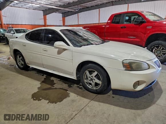 ✅ 2004 Pontiac Grand Prix GT1 • VIN: 2G2WP522041342693 • Lot: 94524795. Wystawiony na Copart z przebiegiem 302 619 mil. Bezpłatny archiwum sprzedaży aukcyjnych z USA i szczegółowy raport historii pojazdu na DreamBid. Zdjęcie 4.