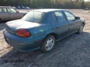 ✅ 1996 Pontiac Grand Am SE • VIN: 1G2NE52M7TC721718 • Lot: 43268073. Wystawiony na IAAI z przebiegiem 115 223 mil. Bezpłatny archiwum sprzedaży aukcyjnych z USA i szczegółowy raport historii pojazdu na DreamBid. Zdjęcie 4.