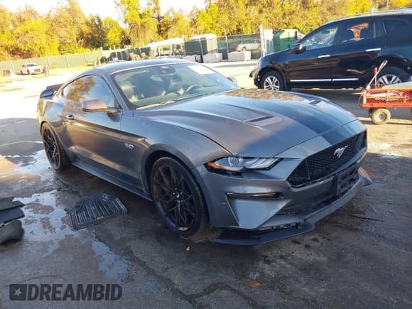 ✅ 2022 Ford Mustang GT • VIN: 1FA6P8CF9N5111974 • Lot: 43567663. Listed on IAAI with 26,474 mi. Free auction sales archive from the USA and detailed vehicle history report at DreamBid. Image 1.