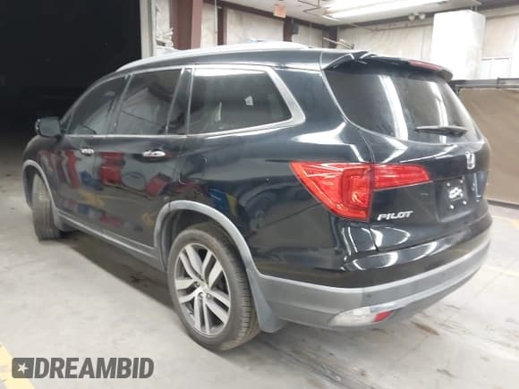 ✅ 2016 Honda Pilot Touring • VIN: 5FNYF5H91GB006631 • Lot: 43566110. Listed on IAAI with 144,494 mi. Free auction sales archive from the USA and detailed vehicle history report at DreamBid. Image 3.