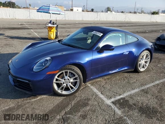 ✅ 2022 Porsche 911 Carrera • VIN: WP0AA2A99NS205256 • Lot: 43082515. Listed on Copart with 21,682 mi. Free auction sales archive from the USA and detailed vehicle history report at DreamBid. Image 1.