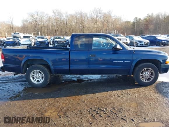 2002 Dodge Dakota Sport z VIN 1B7GL32X52S569340, wystawiony jako IAAI lot #41541480 z przebiegiem 176 632 mil mil oraz . Historia ofert i sprzedaży dostępna na DreamBid. Obrazek 13.