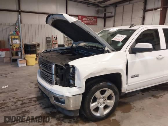 2015 Chevrolet Silverado 1500 LT z VIN 1GCRCREH0FZ398560, wystawiony jako IAAI lot #42454940 z przebiegiem 158 025 mil mil oraz . Historia ofert i sprzedaży dostępna na DreamBid. Obrazek 21.