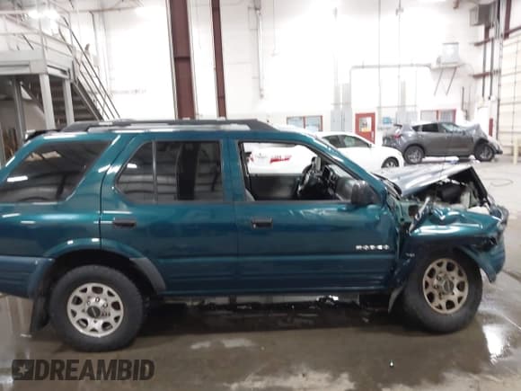 ✅ 1998 Isuzu Rodeo S • VIN: 4S2CK58W4W4337404 • Lot: 43075464. Listed on IAAI with 235,177 mi. Free auction sales archive from the USA and detailed vehicle history report at DreamBid. Image 13.