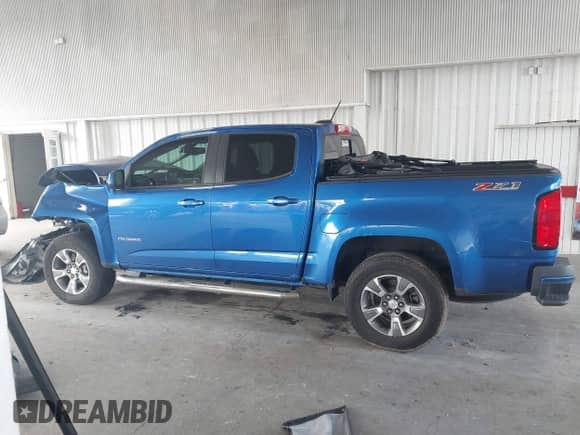2018 Chevrolet Colorado 4WD Z71 z VIN 1GCGTDENXJ1155801, wystawiony jako IAAI lot #43394572 z przebiegiem 75 912 mil mil oraz . Historia ofert i sprzedaży dostępna na DreamBid. Obrazek 14.