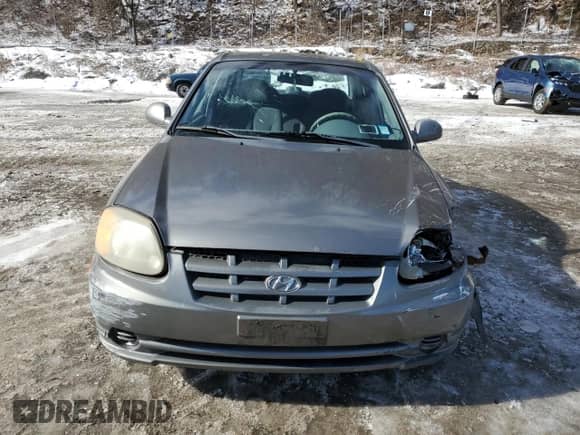 2003 Hyundai Accent GL with VIN KMHCG45C33U469496, listed as a Copart auction lot 45926595 with 77,737 mi miles and Salvage title. Bid and sale history available at DreamBid. Image 5.