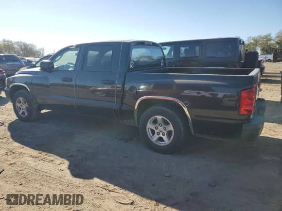 2007 Dodge Dakota ST z VIN 1D7HE28K27S255940, wystawiony jako Copart lot #76308744 z przebiegiem 101 304 mil mil oraz Szkoda całkowita • Salvage title. Historia ofert i sprzedaży dostępna na DreamBid. Obrazek 2.