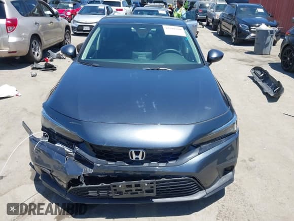 ✅ 2023 Honda Civic LX • VIN: 19XFL2H53PE013386 • Lot: 42702560. Listed on IAAI with 14,471 mi. Free auction sales archive from the USA and detailed vehicle history report at DreamBid. Image 12.