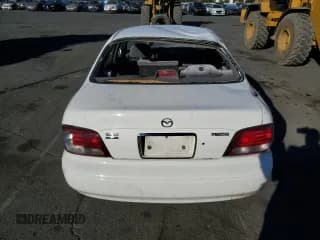 ✅ 1999 Mazda 626 LX • VIN: 1YVGF22D4X5882600 • Lot: 69031604. Wystawiony na Copart z przebiegiem Nie podano. Bezpłatny archiwum sprzedaży aukcyjnych z USA i szczegółowy raport historii pojazdu na DreamBid. Zdjęcie 6.