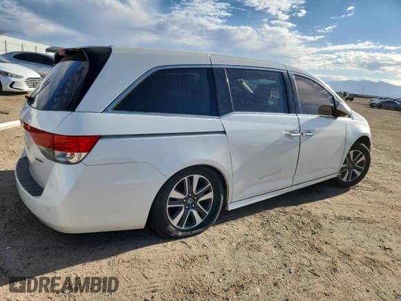 ✅ 2016 Honda Odyssey Touring Elite • VIN: 5FNRL5H90GB031517 • Lot: 87404655. Listed on Copart with 131,680 mi. Free auction sales archive from the USA and detailed vehicle history report at DreamBid. Image 3.