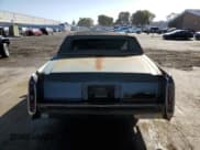 ✅ 1990 Cadillac Brougham • VIN: 1G6DW54Y6LR704123 • Лот: 57709315. Опубликован ранее на Copart с пробегом 118 122 миль. Бесплатный доступ к архиву аукционных продаж из США и подробный отчёт об истории автомобиля на DreamBid. Изображение 6.