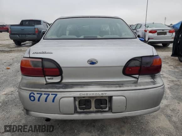 2002 Chevrolet Malibu z VIN 1G1ND52J92M703243, wystawiony jako Copart lot #70475054 z przebiegiem 57 797 mil mil oraz Szkoda całkowita • Salvage title. Historia ofert i sprzedaży dostępna na DreamBid. Obrazek 6.