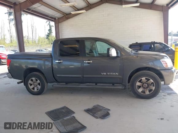 ✅ 2005 Nissan Titan LE • VIN: 1N6AA07B75N553857 • Lot: 42110183. Listed on IAAI with 166,064 mi. Free auction sales archive from the USA and detailed vehicle history report at DreamBid. Image 13.