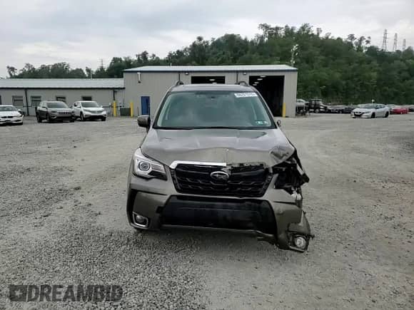 2018 Subaru Forester Touring с VIN JF2SJGWC8JH421727, выставлен на аукционе Copart как лот 68201515 с пробегом 84 424 миль миль и Списание • Salvage title. История ставок и продаж доступна на DreamBid. Изображение 15.