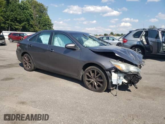 2015 Toyota Camry LE with VIN 4T1BF1FK2FU879326, listed as a Copart auction lot 71708635 with 128,243 mi miles and Salvage title. Bid and sale history available at DreamBid. Image 4.