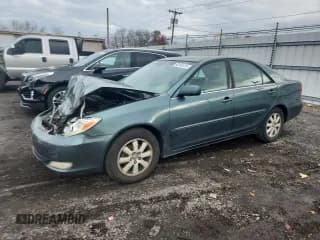✅ 2004 Toyota Camry LE • VIN: 4T1BE30K04U273446 • Lot: 92148135. Listed on Copart with 292,330 mi. Free auction sales archive from the USA and detailed vehicle history report at DreamBid. Image 1.